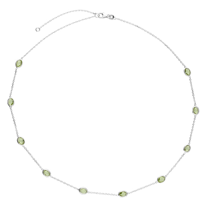 Silver and lab grown peridot station necklace