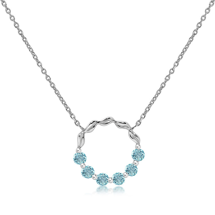 Silver and blue topaz circle pendant