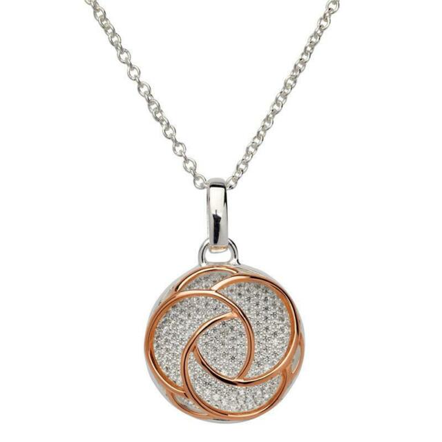 Silver, rose gold detail and cubic zirconia round pendant