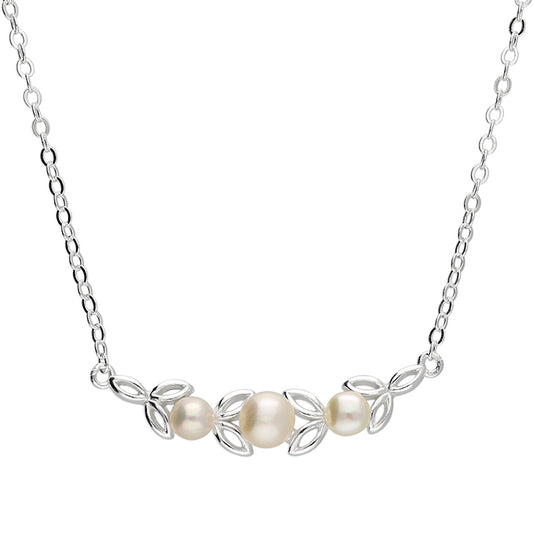 Silver and freshwater pearl charm necklace