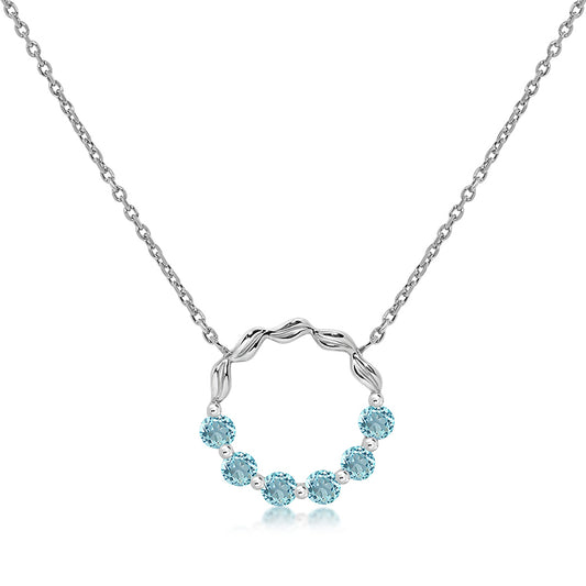 Silver and blue topaz circle pendant