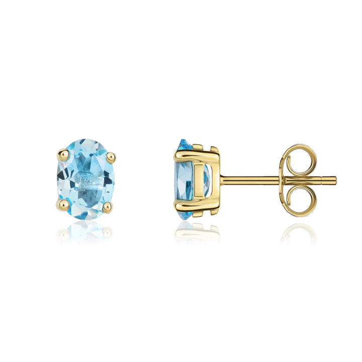 9CT Gold And Blue Topaz Oval Stud Earrings