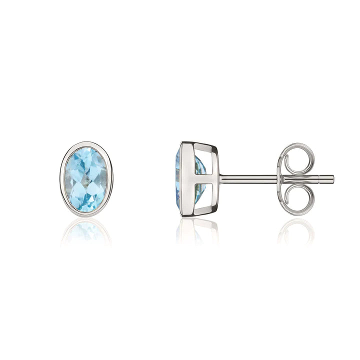 9CT White Gold And Blue Topaz Oval Stud Earrings